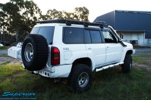Rear right view of a White Nissan GU Patrol Wagon after fitment of a range of high quality Superior Engineering 4x4 Suspension & Accessories