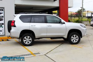Right side view of a Silver Toyota 150 Landcruiser Prado Wagon after fitment of a Superior Remote Reservoir 2" Inch Lift Kit