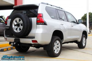 Rear right view of a Silver Toyota 150 Landcruiser Prado Wagon after fitment of a Superior Remote Reservoir 2" Inch Lift Kit