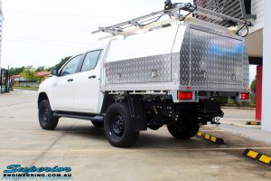Rear left view of a White Toyota Revo Hilux Dual Cab after fitment of a Bilstein 2" Inch Lift Kit