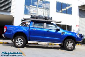 Right side view of a Ford PXII Ranger in Blue after fitment of a Superior Nitro Gas 2" Inch Lift Kit