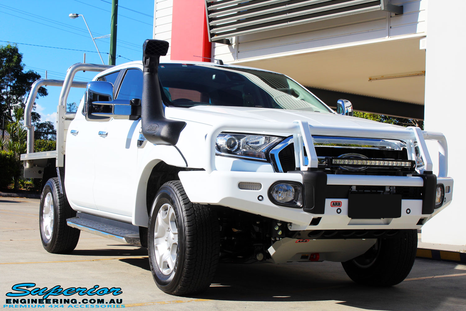 Right front side view of a Ford PXII Ranger in White On The Hoist @ Superior Engineering Deception Bay Showroom