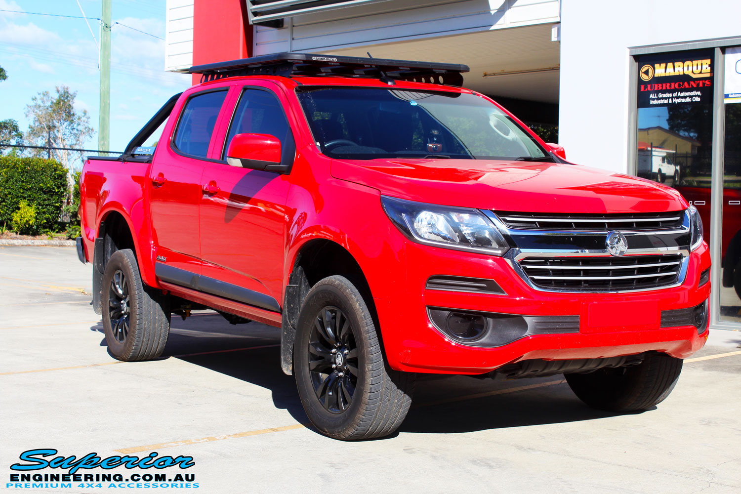 Right front side view of a Absolute Red Holden Colorado RG after fitment of a Bilstein 45mm Lift Kit