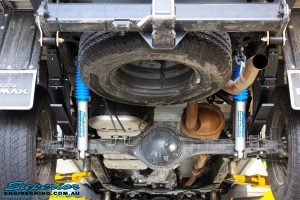 Rear underbody view of the fitted Superior Nitro Gas 2" Shocks + Leaf Springs & U-Bolt Kit