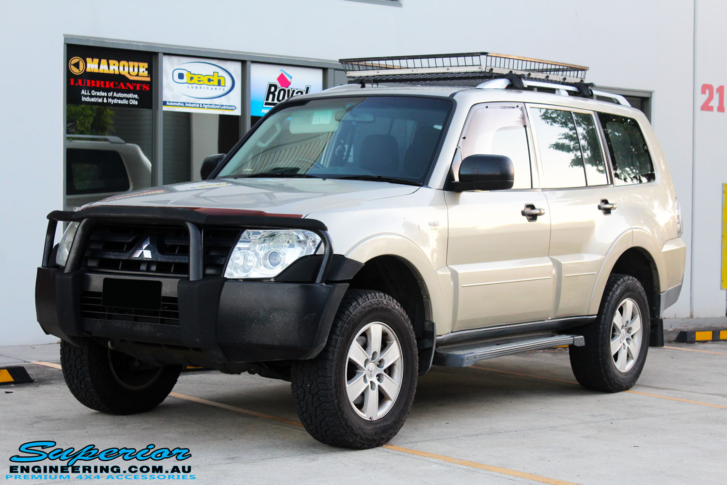 Left front side view of a Gold Mitsubishi NS Pajero Wagon after fitment of a Tough Dog 40mm Lift Kit