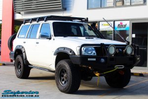 Right front side view of a White Nissan GU Patrol Wagon after fitment of Superior Hyperflex Radius Arms With Drop Boxes