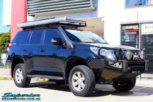 Right front side view of a Toyota 150 Landcruiser Prado in Blue after fitment of a 2" Inch Lift Kit & Heavy Duty Towing Points