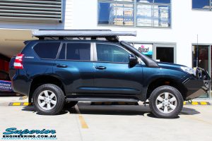 Side right view of a Toyota 150 Landcruiser Prado in Blue after fitment of a 2" Inch Lift Kit & Heavy Duty Towing Points