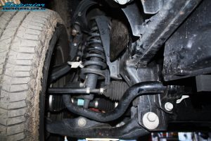Front right inside view of the previous strut and coil spring before new ones are fitted