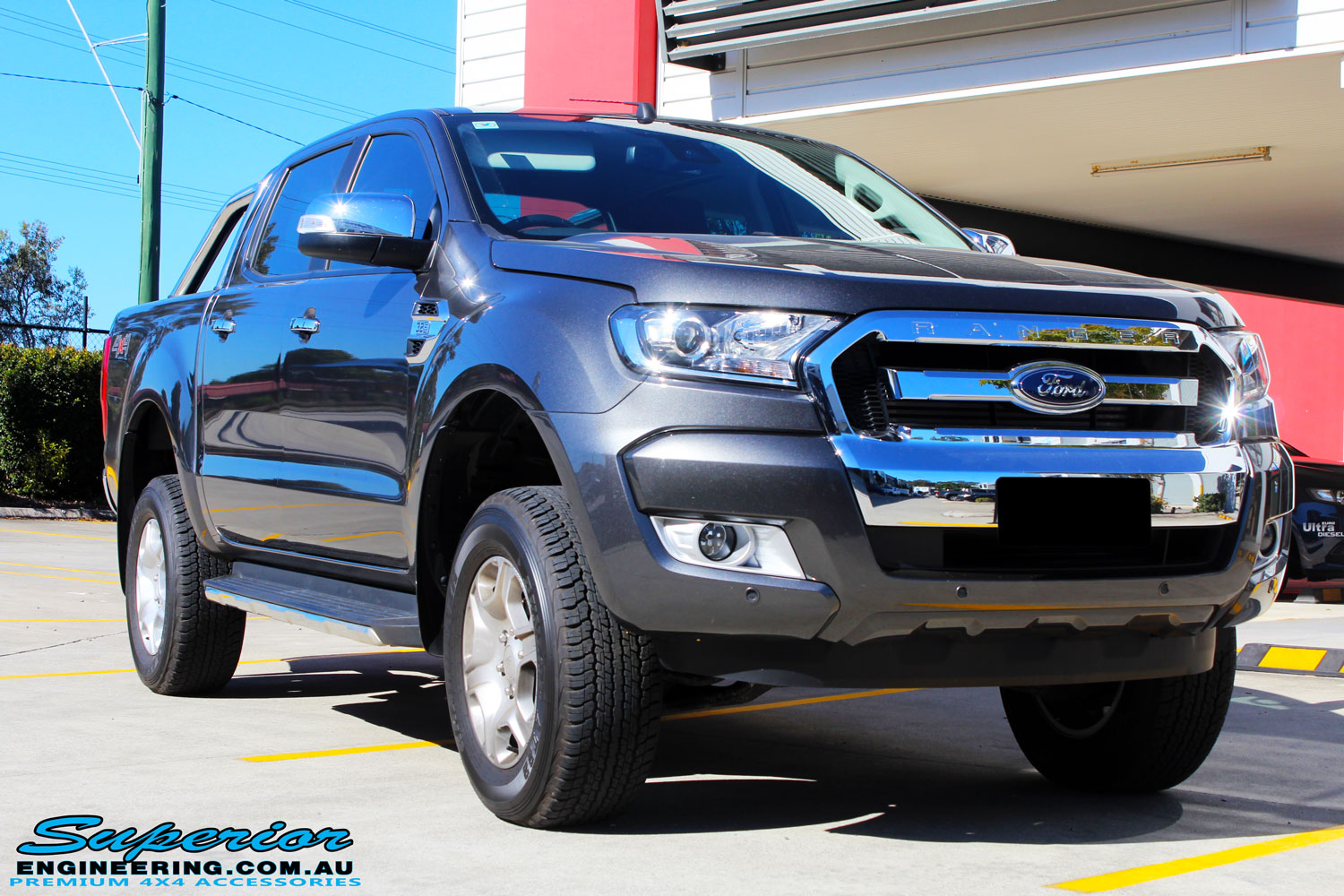 Right front side view of a Ford PXII Ranger in Grey after fitment of a Super Pro Ezy Lift 45mm Lift Kit