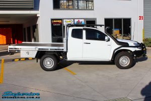 Right side view of a Isuzu D-Max Extra Cab in White On The Hoist @ Superior being fitted with a Chassis Brace/Repair Plate