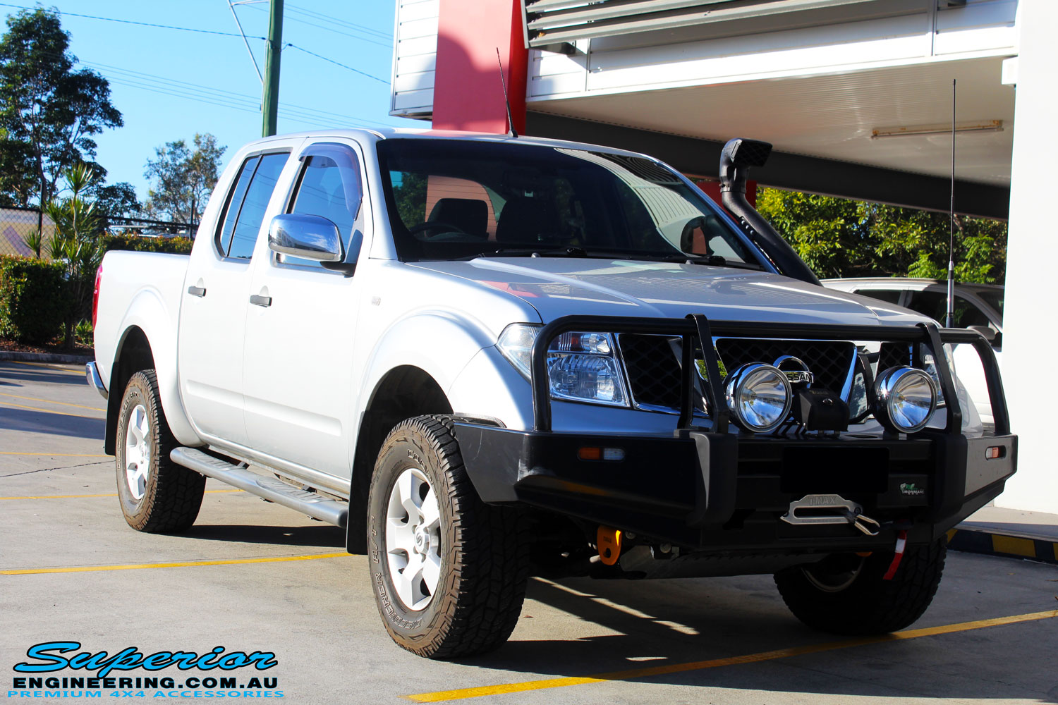 Right front side view of a Silver Nissan D40 Navara being fitted with a Brown Davis Long Range Fuel Tank @ Superior