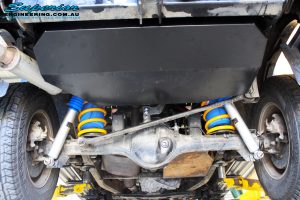 Rear underbody view of the fitted Brown Davis Long Range Fuel Tank, Airbag Man 2" Inch Coil Air Helper, Rear Superior Nitro Gas Shocks & King Springs