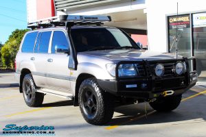 Right front side view of a Silver Toyota 100 Series Landcruiser before fitment of a 2" Inch Lift Kit with Airbags