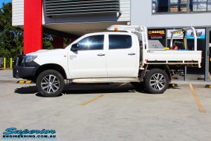 Left side view of a Toyota Vigo Hilux Dual Cab in White after fitment of a Superior Nitro Gas 2" Inch Lift Kit