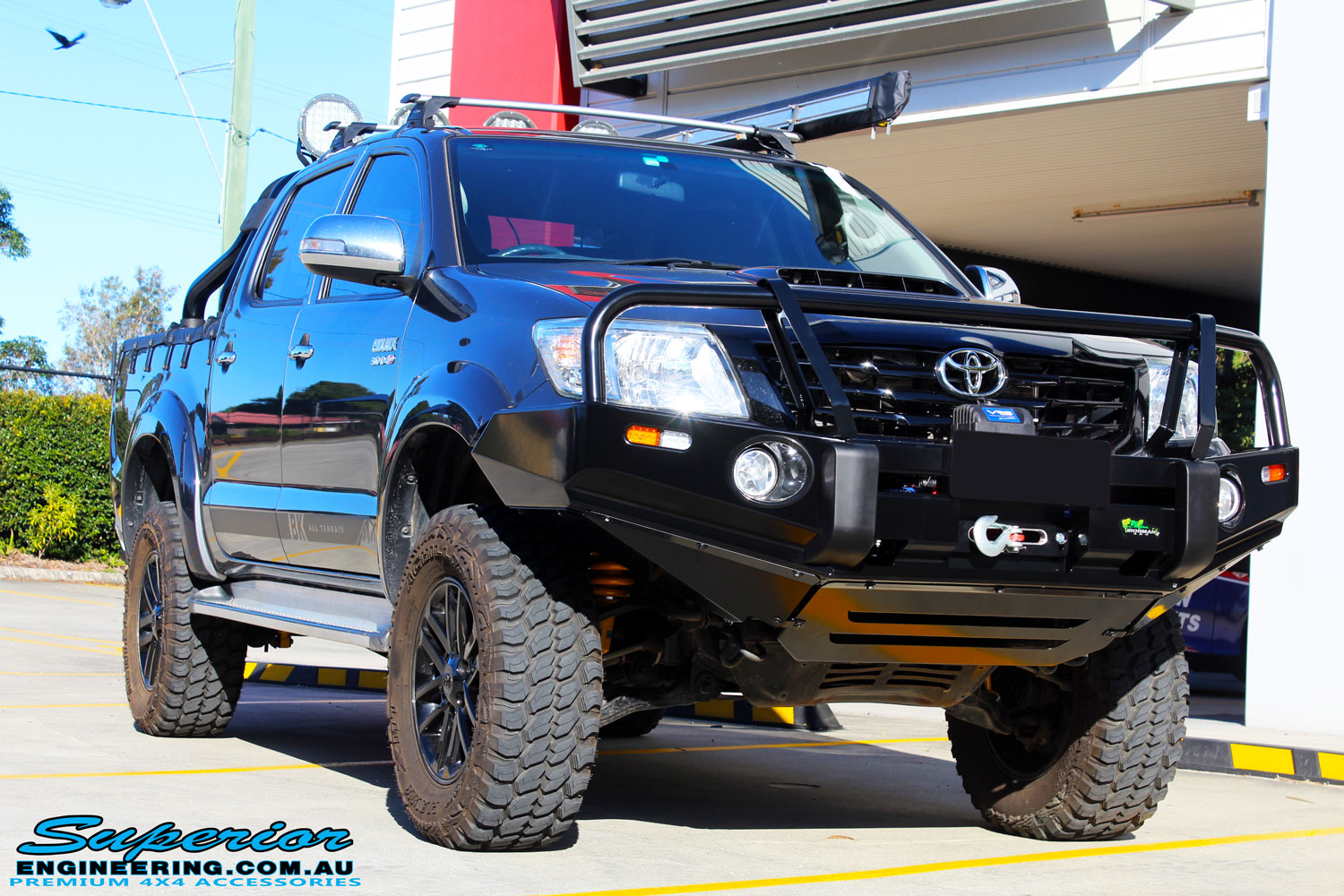 Right front side view of a Grey Toyota Vigo Hilux Dual Cab after fitment of a 2" Inch Lift Kit, VRS Winch & Ironman 4x4 Bullbar