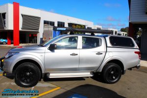 Left side view of a Mitsubishi MQ Triton in Silver before fitment of a Superior Nitro Gas 30mm Lift Kit