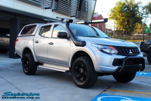 Left front side view of a Mitsubishi MQ Triton in Silver after fitment of a Superior Nitro Gas 30mm Lift Kit