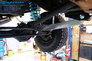 Front right underbody shot of the fitted Hybrid Superflex Radius Arm with Dobinson Coil Spring