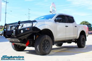 Left front side view of a Grey Nissan NP300 Navara Ute after fitment of a Superior Remote Reservoir 2" Inch Lift Kit + Ironman 4x4 Deluxe Black Bull Bar & Superior 2" Inch Body Lift
