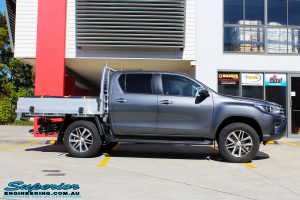 Right side view of a Toyota Revo Hilux Dual Cab in Grey before fitment of a Fox 2.0 Performance Series IFP 2" Inch Lift Kit + Upper Control Arms