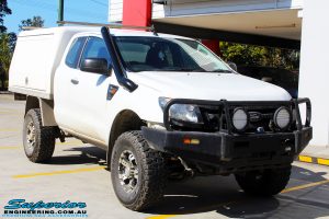 Right front side view of a Ford PX Ranger in White before fitment of a Superior 4" Inch Remote Reservoir Lift Kit
