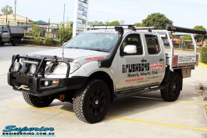 Left front side view of a Nissan D40 Navara Dual Cab in Silver after fitment of Dobinson 40mm Front Coil Springs