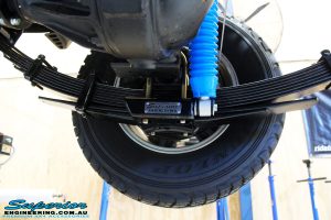 Rear right shot of the fitted Superior 4" Inch Remote Reservoir Shock + Mount & Leaf Spring with U-Bolt Kit