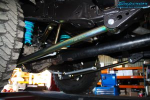 Mid rear right view of the fitted Superior Lower Control Arm, Sway Bar Kit & Airbag Man Coil Air Helper Kit with Coil Spring