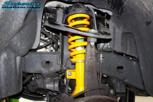 Front left inside view of the fitted Front 2" Inch Strut + Coil Spring