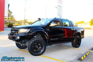 Front left side view of the Ford PXII Ranger in Black after fitment of a Superior 3" Inch Remote Reservoir Lift Kit, Rhino 4x4 Winch Bar, VRS Winch, GME UHF CB & Antenna, Nitto Ridge Grappler Tyres & Fuel Vaper Matte Black Wheels