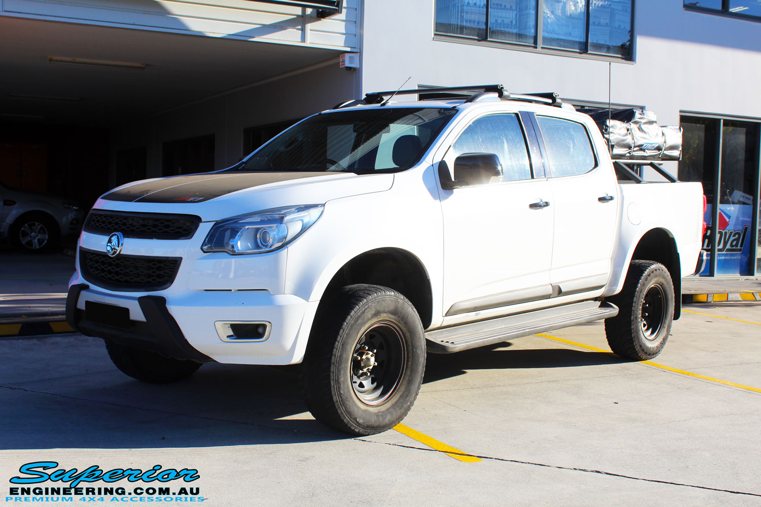 Left front side view of a White Holden RG Colorado Dual Cab after fitment of a Superior Nitro Gas 3" Inch Lift Kit