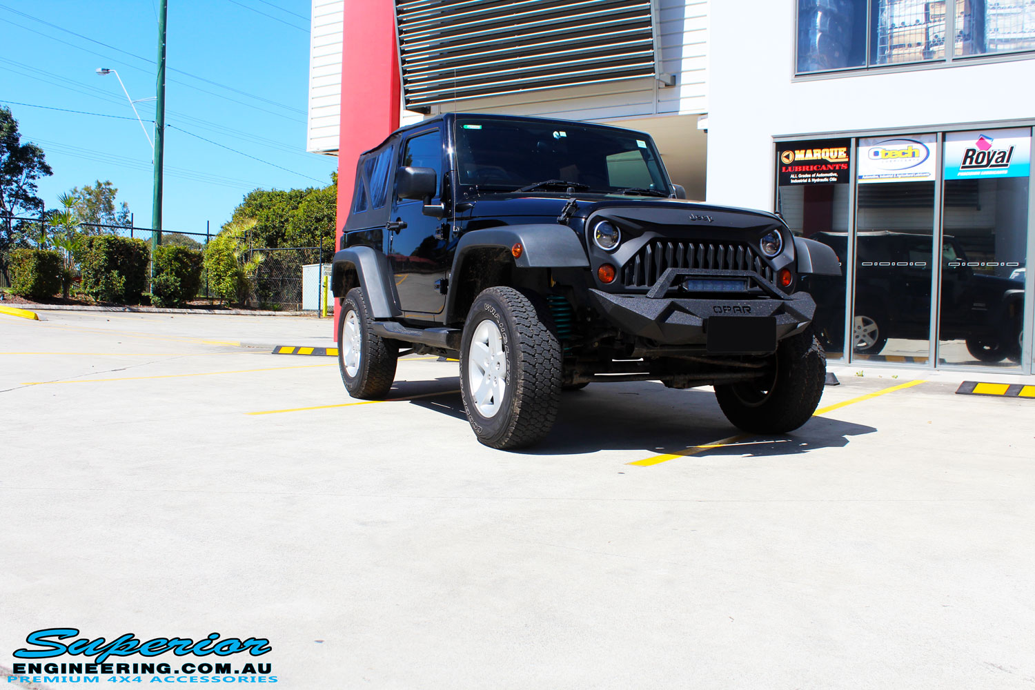 Right front side view of a Black Jeep JK SWB after fitment of a Dobinson 50mm Lift Kit