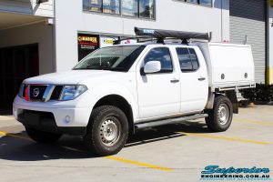 Left front side view of a Nissan D40 Navara Dual Cab after fitment of a Superior Nitro Gas 2" Inch Lift Kit