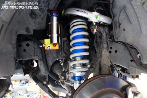 Front left inside guard shot of the fitted 3" Inch Remote Reservoir Front Strut, Coil Spring & Chromoly Upper Control Arm