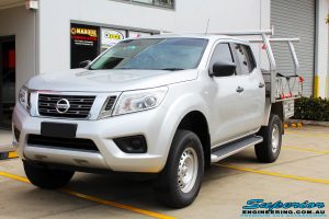 Left front side view of a Silver Nissan NP300 Navara Dual Cab after fitment of a Superior Remote Reservoir 2 Inch Lift Kit & Airbag Man Coil Air Kit 2" Inch Lift