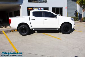 Right side view of a White Nissan NP300 Navara Dual Cab before fitment of a range of Superior and various other brands suspension components