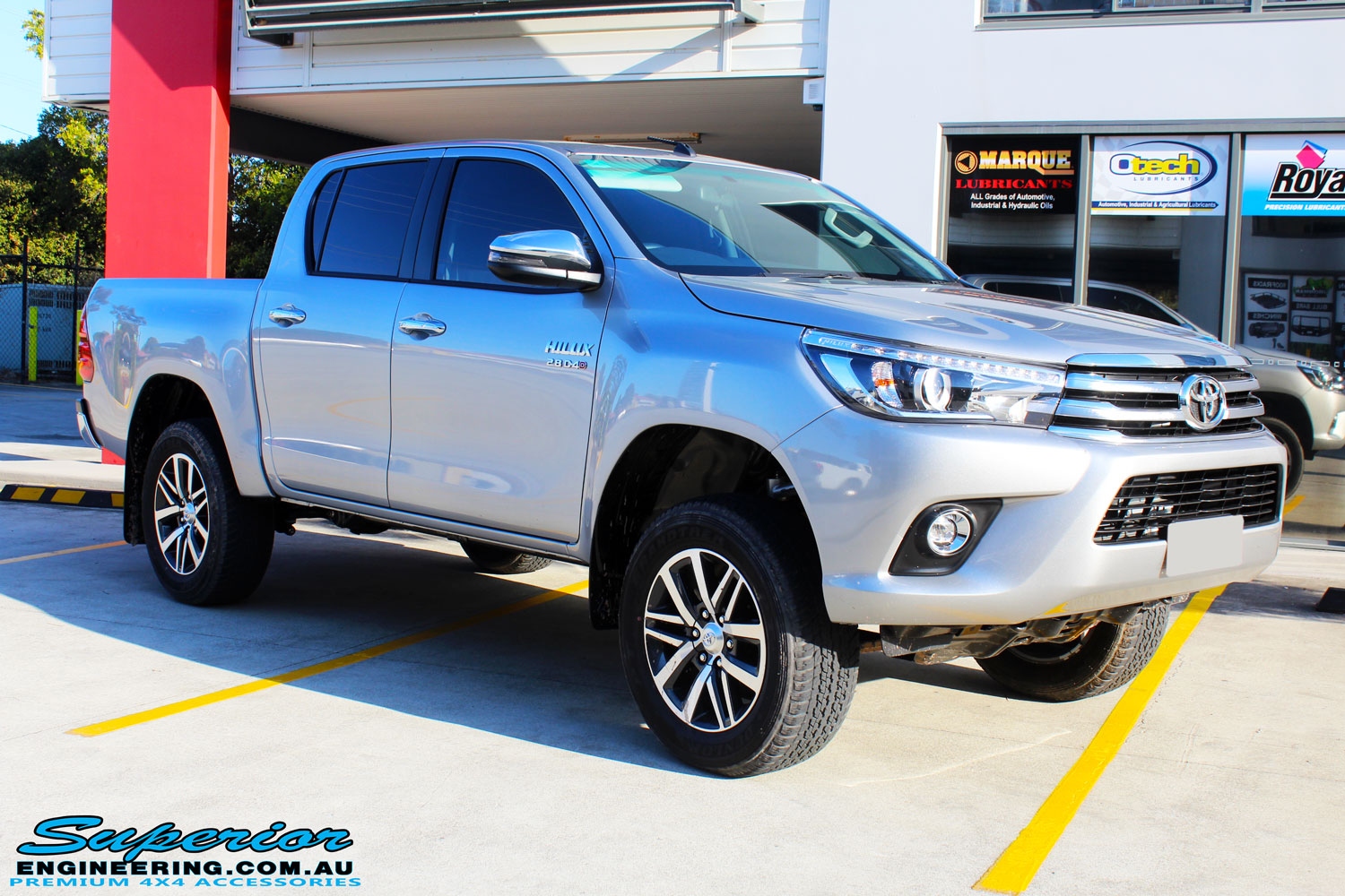 Right front side view of a Silver Toyota Revo Hilux Dual Cab after fitment of a range of Superior and various other brands suspension components