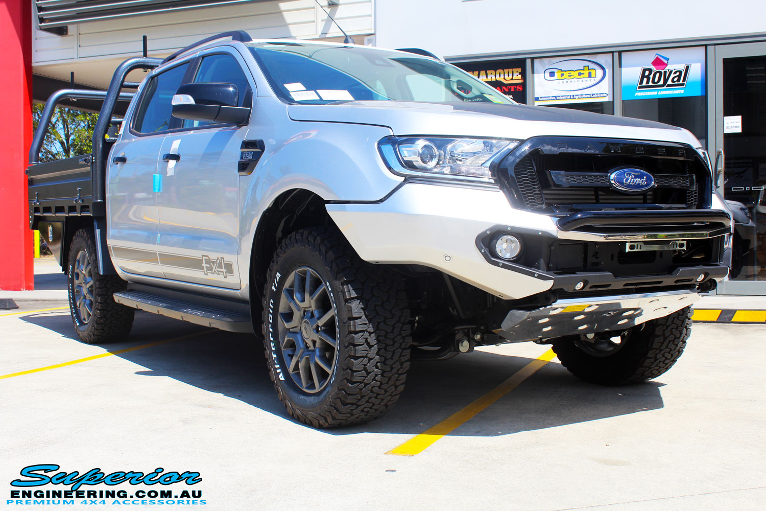 Right front side view of a Silver Ford PXIII Ranger Dual Cab after fitment with a Rhino 4x4 Evolution 3D Winch Bar
