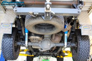Rear underbody view of the fitted Superior Nitro Gas 2" Shocks + Leaf Springs & U-Bolt Kit