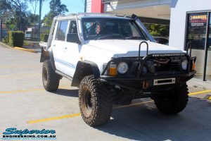 Right front side view of a White Nissan GQ Patrol Dual Cab before fitment of a range of Superior and various other brands suspension components