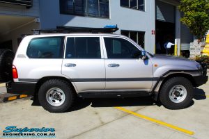 Right side view of a Silver Toyota 105 Landcruiser Wagon before fitment of a Superior Nitro Gas 2" Inch Lift Kit, Snorkel & Eaton Harrop Front & Rear E-Lockers