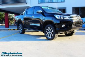 Right side view of a Toyota Revo Hilux Dual Cab in Black after fitment of a Superior Remote Reservoir 3" Inch Lift Kit