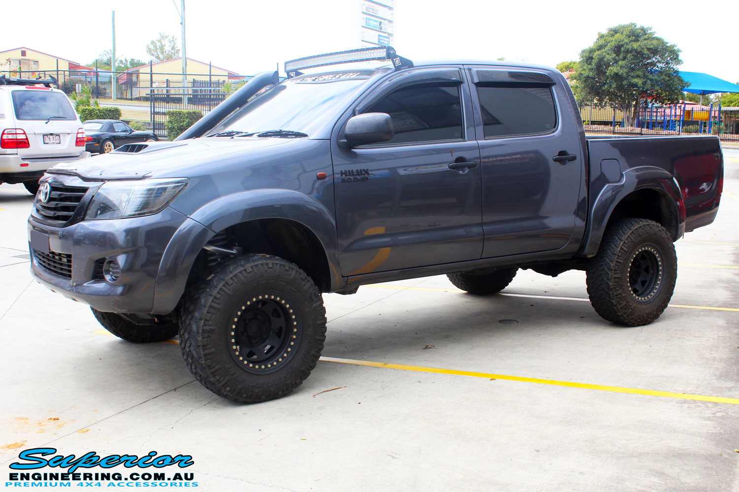 Left front side view of a Grey Toyota Vigo Hilux after fitment of a range of Superior and various other brands suspension components