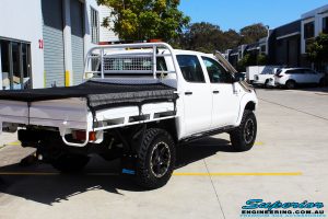 Rear right view of a Toyota Vigo Hilux Dual Cab in White before fitment of a Superior Nitro Gas 2" Inch Lift Kit, Rhino 4x4 Evolution 3D Winch Bar, VRS Winch, Legendex 409 Stainless Steel 3" Exhaust, Legendex Thrust Monkey Throttle Control, Legendex Rock Sliders, Legendex Optimizer Remap Service, Stainless Snorkel & Nitto Trail Grappler Tyres