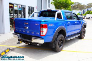 Rear right view of a Blue Ford PXII Ranger before fitment of a Superior Nitro Gas 2" Inch Lift Kit with King Springs & EFS Springs