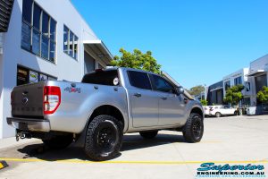 Rear right view of a Silver Ford PXII Ranger before fitment of a Bilstein 2" Inch Lift Kit with King Springs & EFS Leaf Springs