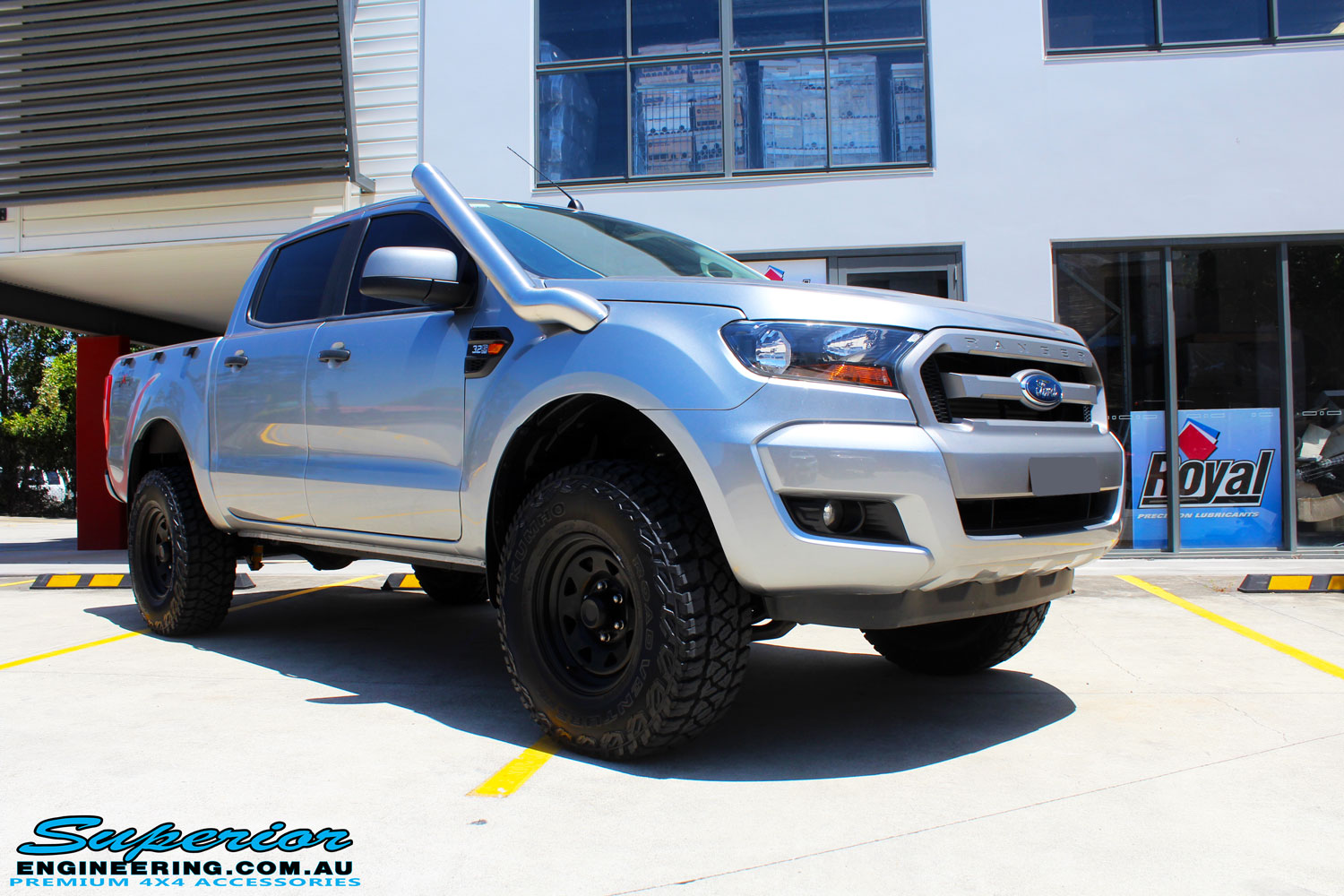 Right front side view of a Silver Ford PXII Ranger after fitment of a Bilstein 2" Inch Lift Kit with King Springs & EFS Leaf Springs