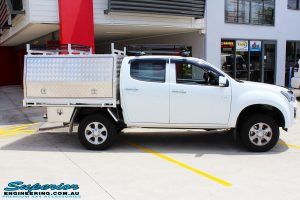 Right side view of a White Isuzu D-Max Dual Cab after fitment of a Superior Nitro Gas 2" Inch Lift Kit