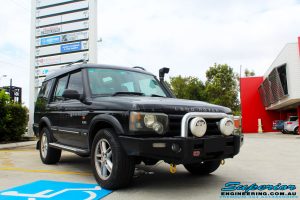 Right front side view of a Black Landrover Discovery 2 before fitment of a Tough Dog 35mm Lift Kit